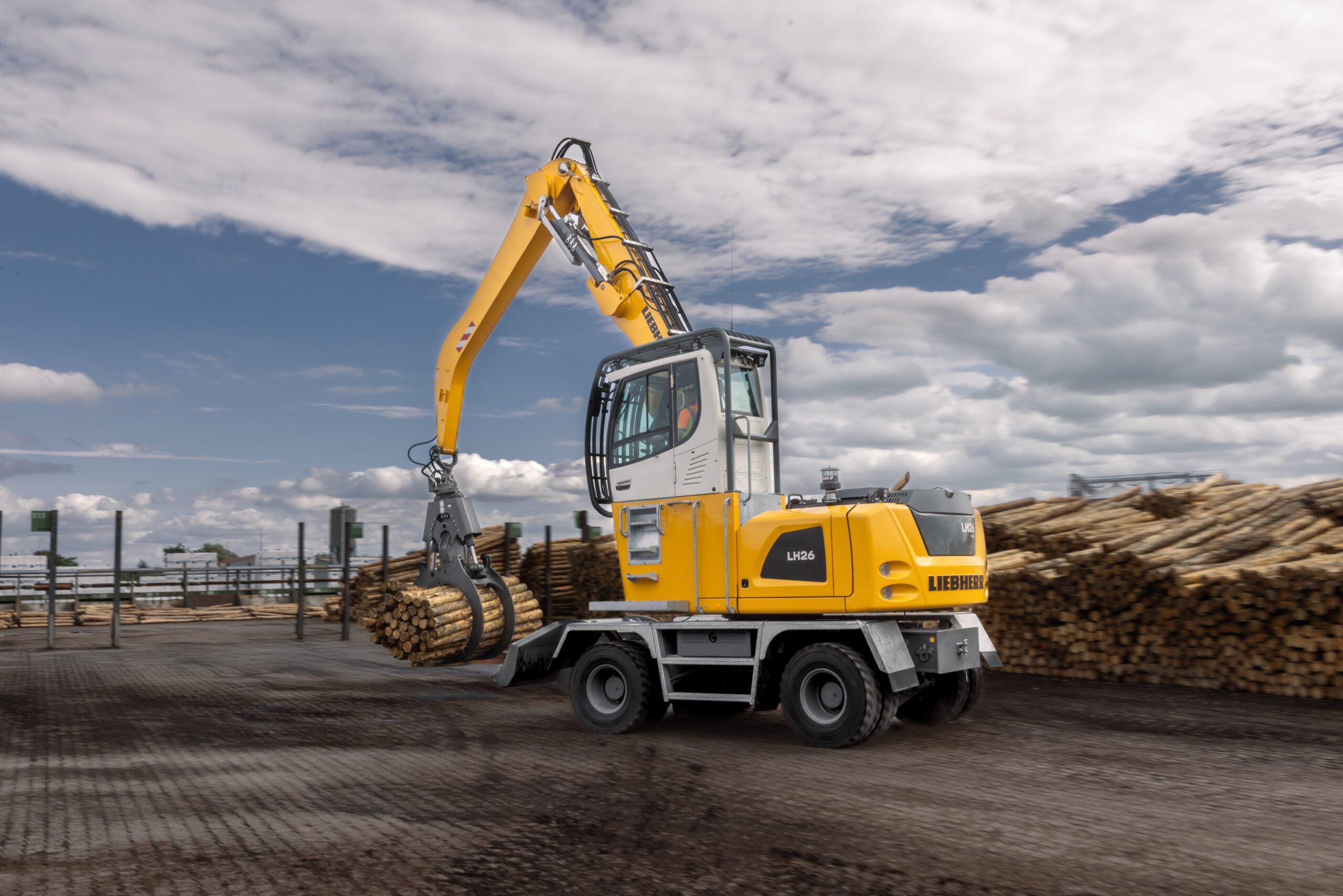 Liebherr's LH 26 M Timber telescoping handler lifting timber