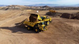 An autonomous Komatsu HD605-10 running on Komatsu Smart Quarry Autonomous, powered by Pronto, being loaded at Komatsu’s Arizona Proving Grounds
