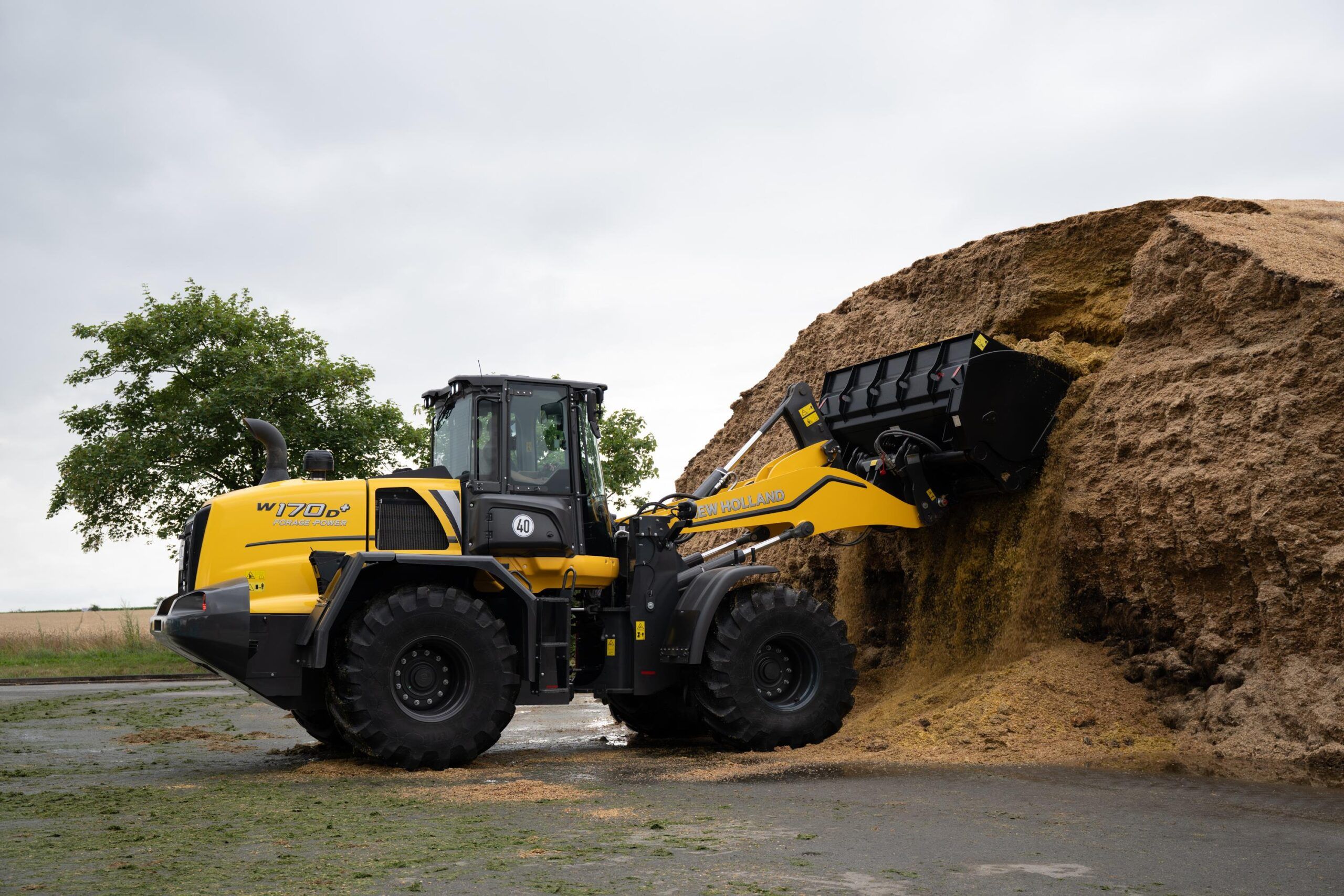 The Forage Power moving dirt from a dirt mound 