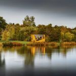 JCB unveils giant ‘Backhoe in a Box’ installation for 80th anniversary