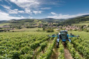 New Holland's 9.80N narrow-row self-propelled grape harvester in a vineyard