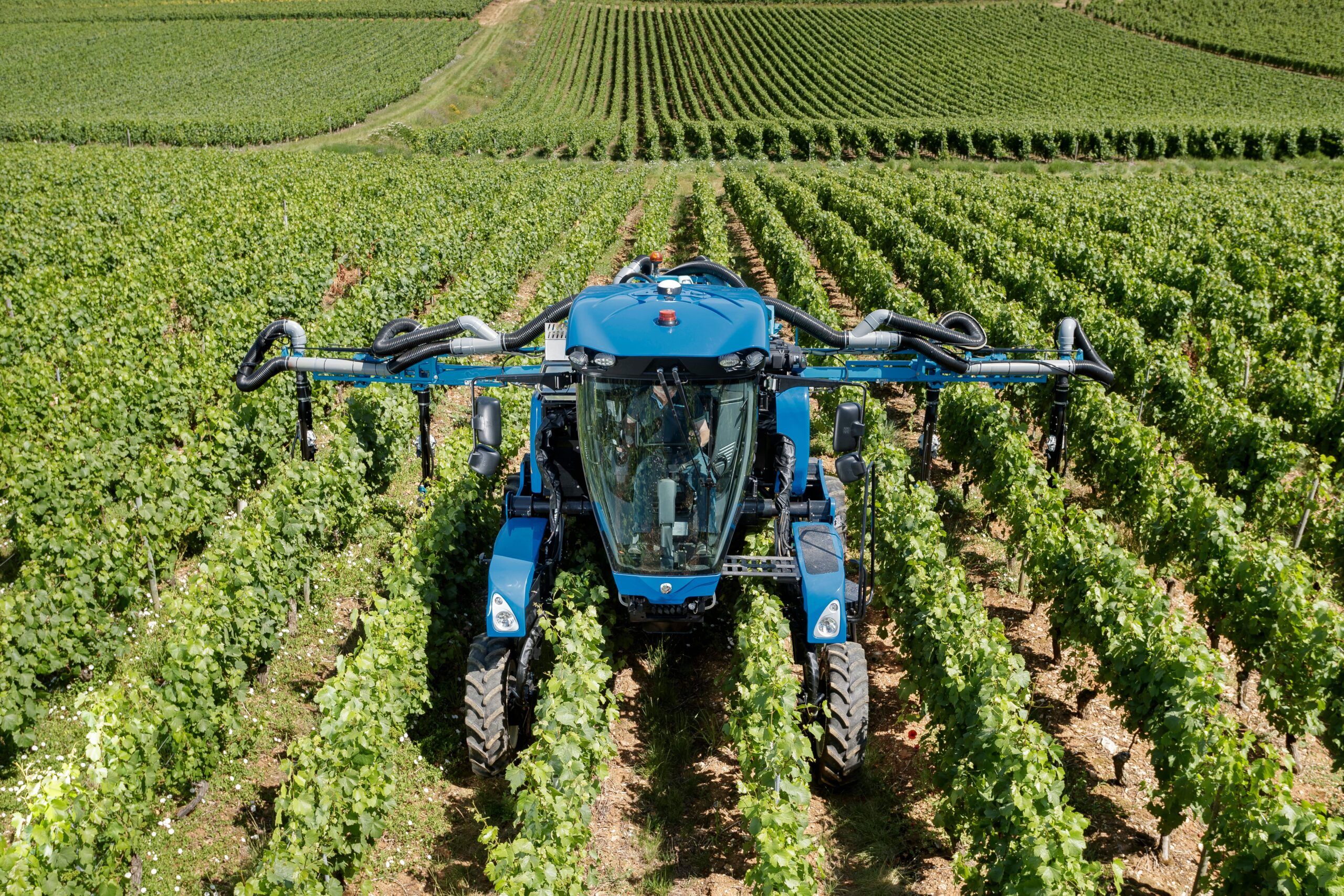 New Holland's 9.80N narrow-row self-propelled grape harvester in a vineyard