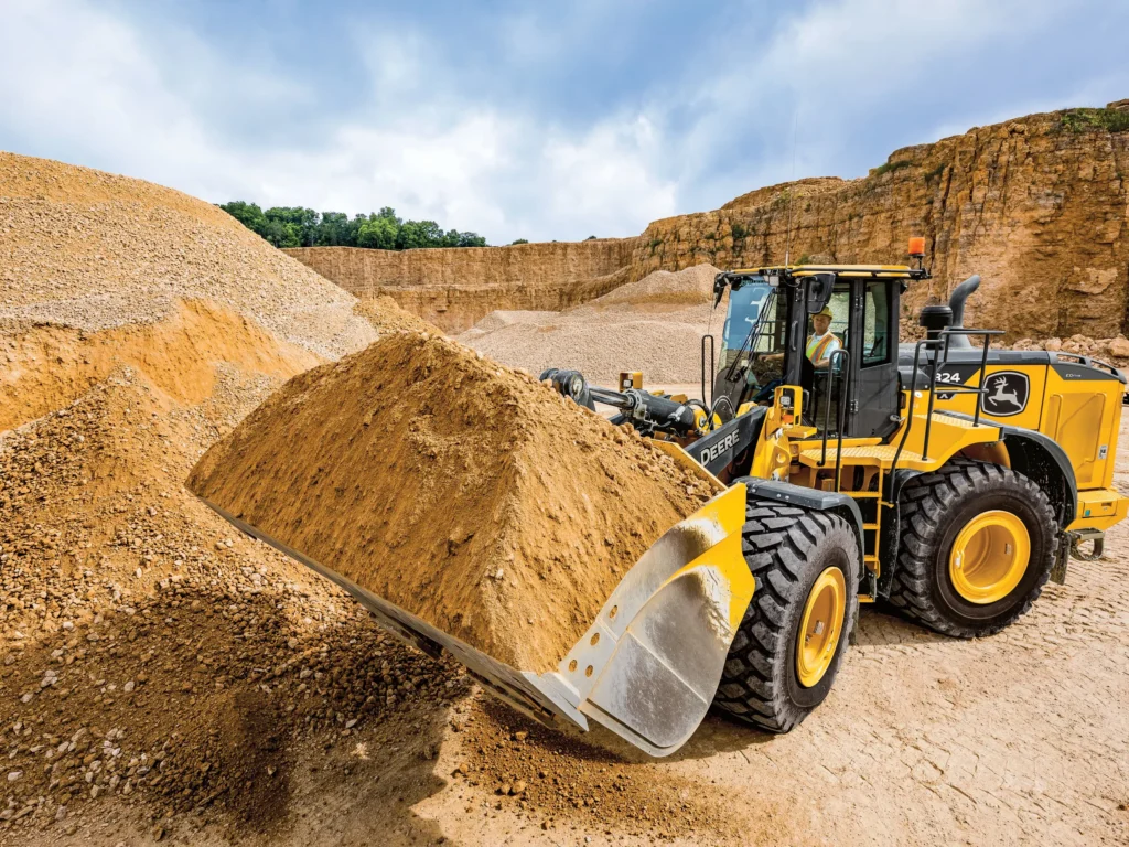 A yellow wheel loader working in a quarry