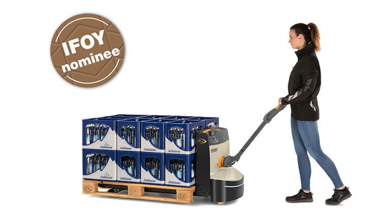 Operator using a Crown WJ 50 Series walkie pallet truck to move a loaded pallet