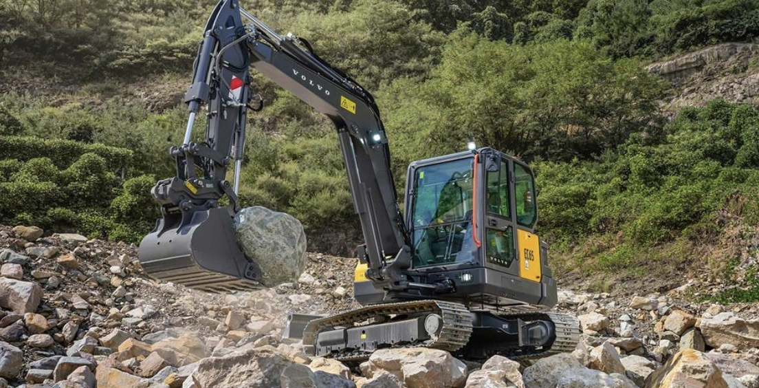 The Volvo EC65 crawler excavator operating on rocky terrain