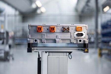 Danfoss Editron ED3 onboard charger with aluminium housing and orange high-voltage connectors