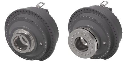 Two rendered views of the Vickers by Danfoss ICMB industrial cam lobe motor, a compact cylindrical radial piston hydraulic motor finished in dark grey, showing different shaft interface configurations