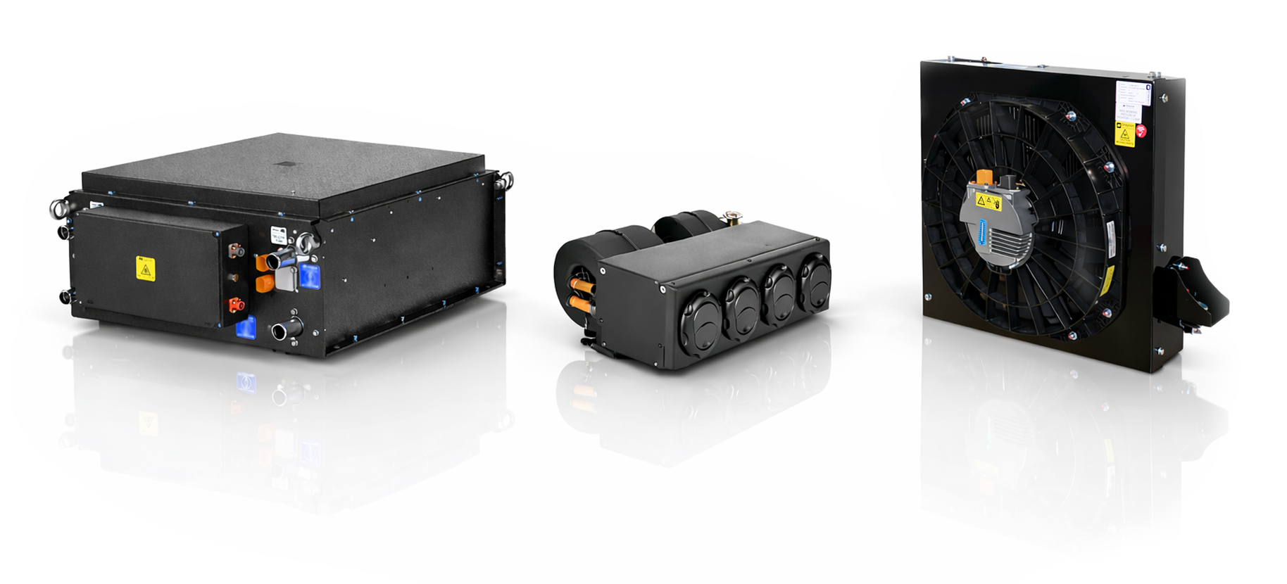 Photograph of three Grayson thermal management units displayed against a white background: the CM1 complete thermal management system on the left, the DMZ cabin HVAC unit in the centre, and the PE1 power electronics cooler on the right