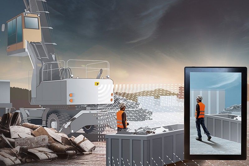 A composite illustration showing a Liebherr material handler equipped with the Lixplore camera system detecting a pedestrian in a high-visibility vest, with the camera feed displayed on a monitor screen