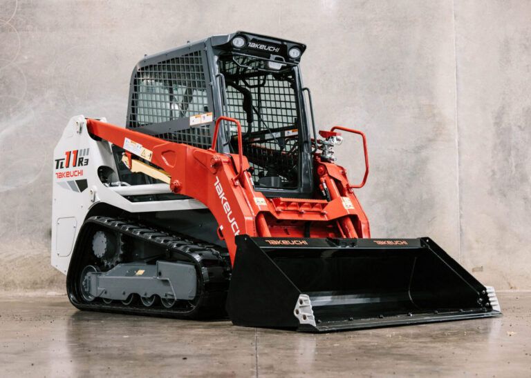 Takeuchi introduces new TL11R3 compact track loader Front three-quarter studio view of a Takeuchi TL11R3 compact track loader with the bucket attachment lowered