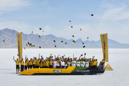 Hydrogen-powered JCB Hydromax sets world land speed record The long, low JCB Hydromax streamliner in yellow and black livery on the white Bonneville salt flats, with the team celebrating and throwing caps in the air behind it