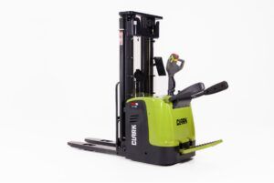 Studio product shot of the green and black Clark RSE16 ride-on high-lift truck with a fold-down operator platform and mast, against a white background