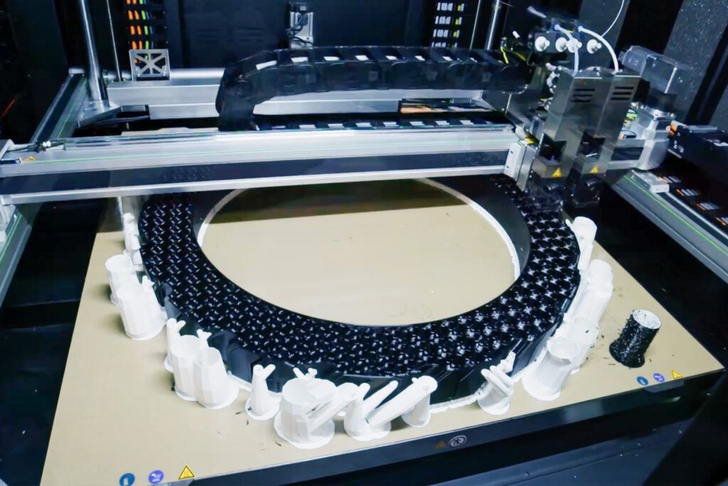 A large-format 3D printer used by OTR Engineered Solutions to produce off-the-road tire and component prototypes