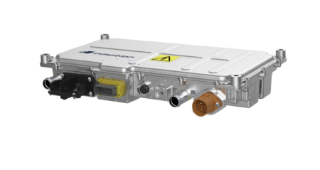 IAA TRANSPORTATION: Inmotion Technologies expands power electronics range A compact silver aluminium DC/DC converter with a finned housing, high-voltage hazard label and orange and black connectors on its front face