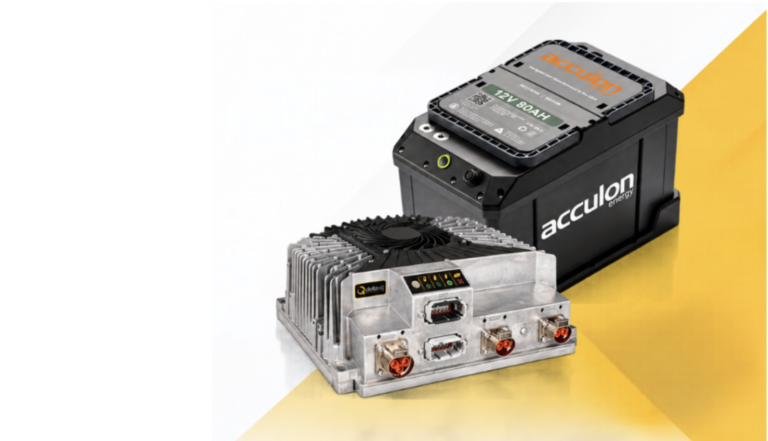 Acculon joins Delta-Q compatibility programme An Acculon 12V 80Ah sodium-ion battery in a black casing with an orange logo, pictured beside a finned aluminium Delta-Q charger with status indicators and power connectors, on a yellow and white background.
